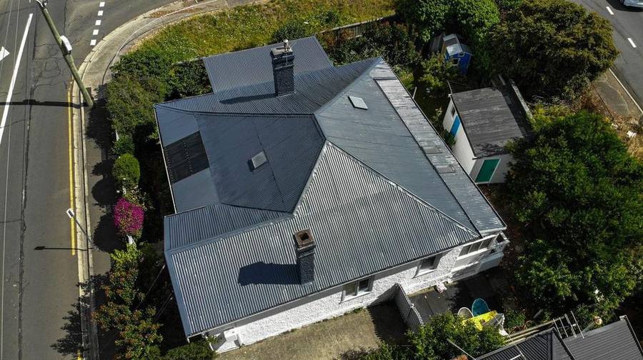 Corner block, patchy hip roof after coating