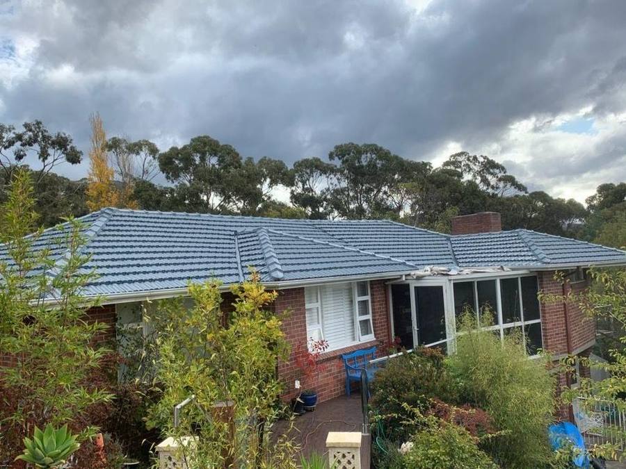 Tiled roof, moss and weathering after coating