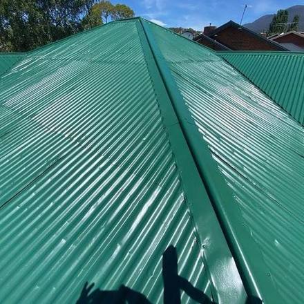 Metal roof recoated in full gloss green
