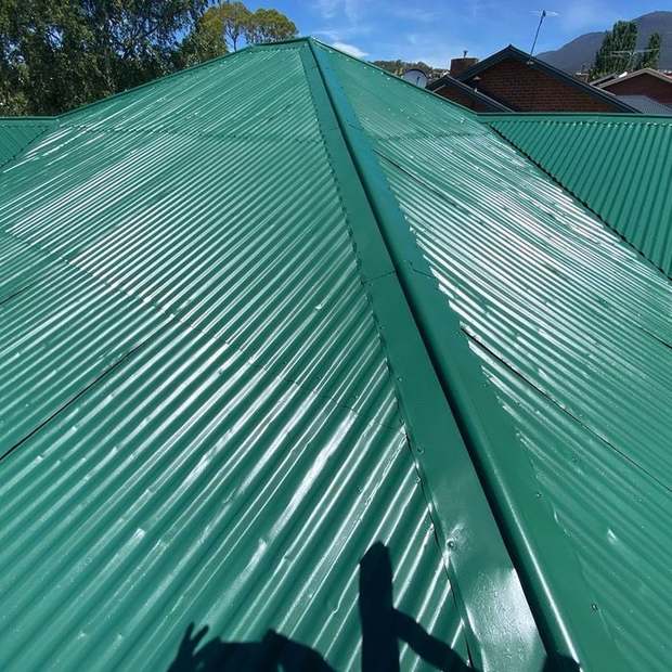 Metal roof recoated in full gloss green